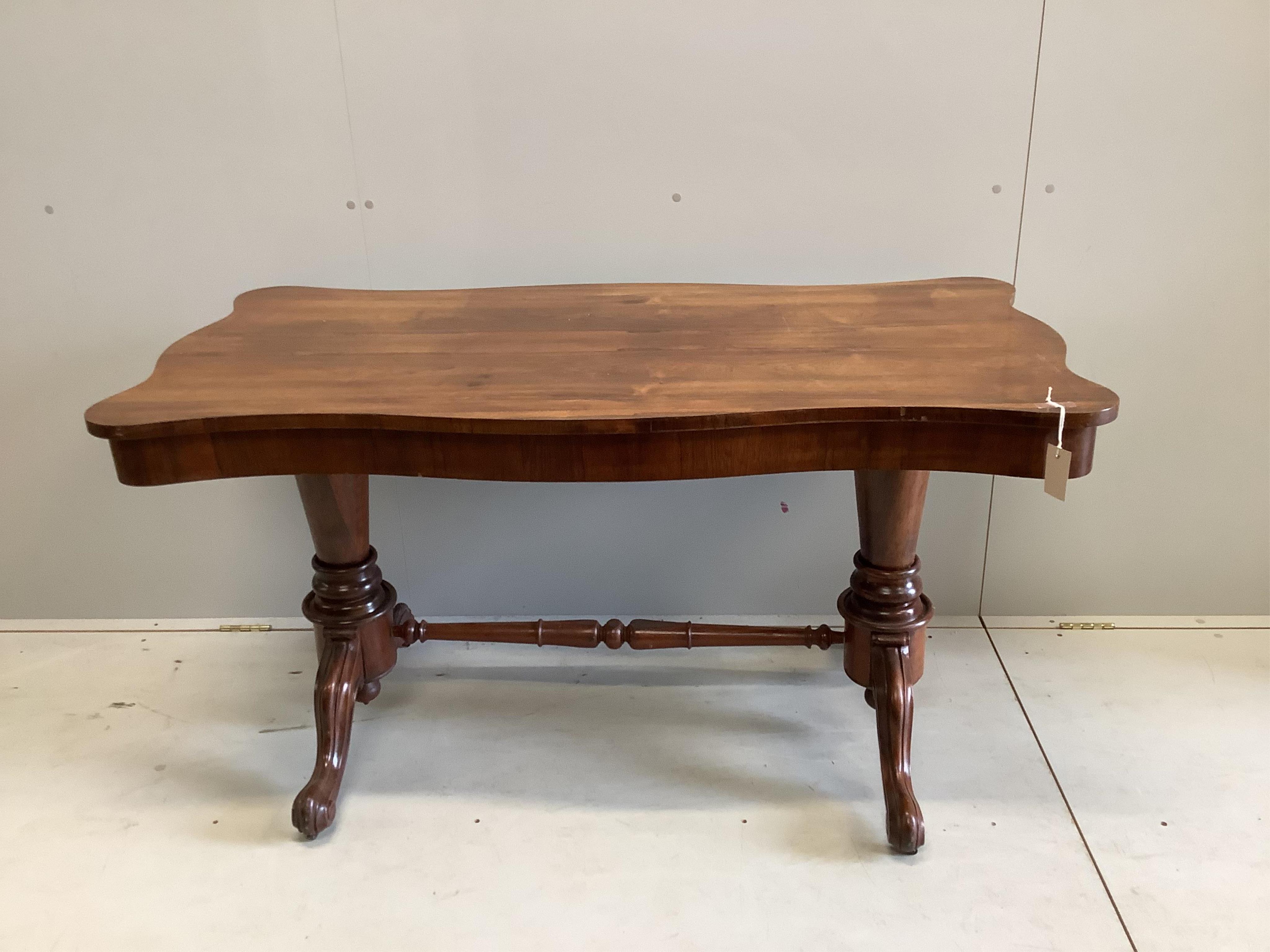 A Victorian rosewood serpentine centre table, width 137cm, depth 69cm, height 73cm. Condition - fair